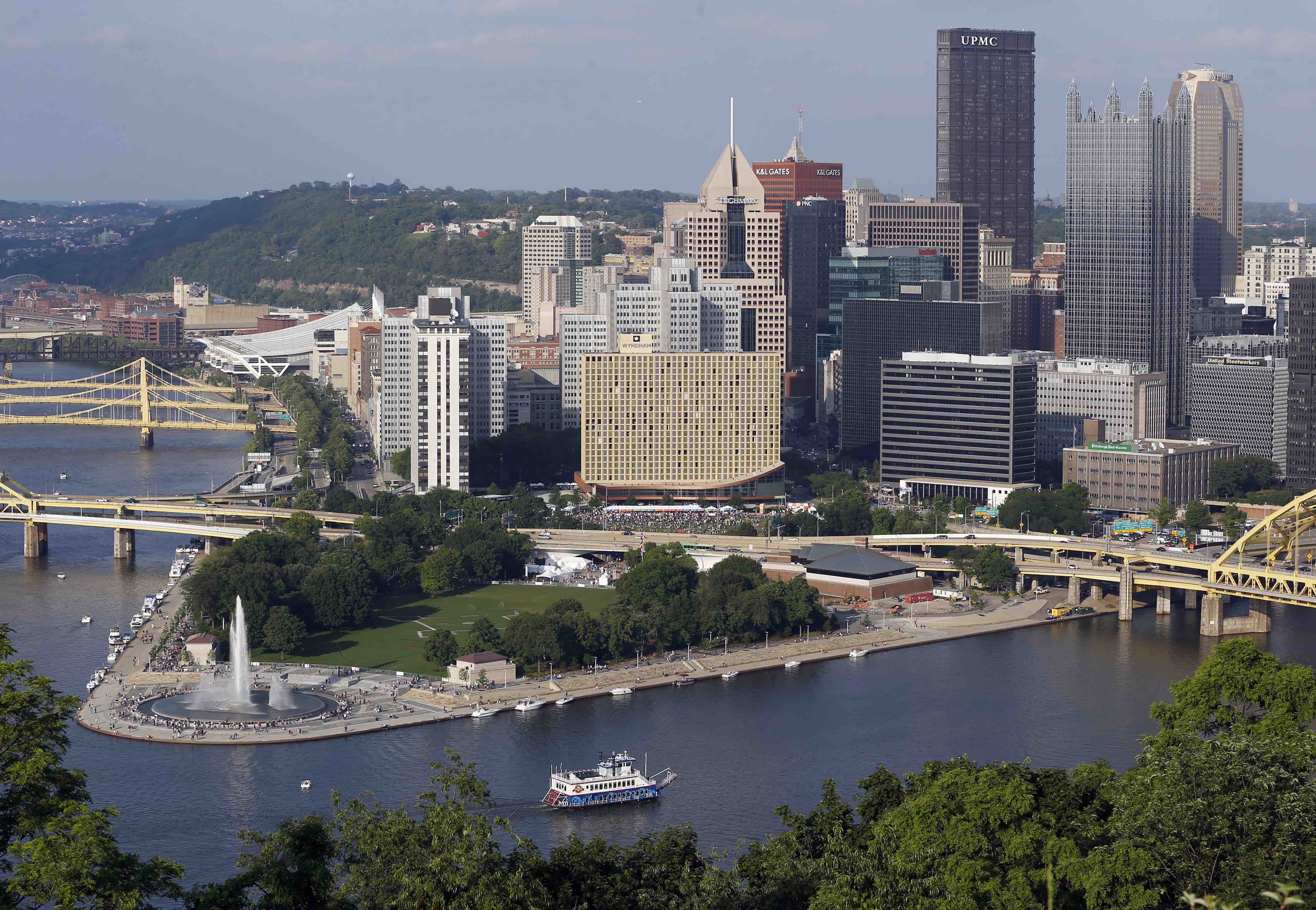 The Pittsburgh skyline raises above the newly renovated fountain at Point State Park, left, on Saturday, June 8, 2013, in Pittsburgh. The iconic fountain at the confluence where the Allegheny and Monongahela Rivers meet to form the Ohio River, was originally opened in 1974. It had been shut off since 2009 and was reopened on Friday, June 7, 2013 after it underwent an $11.9 million restoration. (AP Photo/Keith Srakocic)