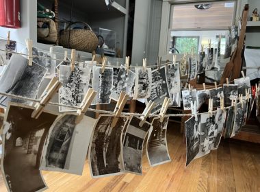 Photos from the archives at the Hindman Settlement School in Eastern Kentucky hang from makeshift lines to dry and, hopefully, save. Photo: Erin Reid/Provided
