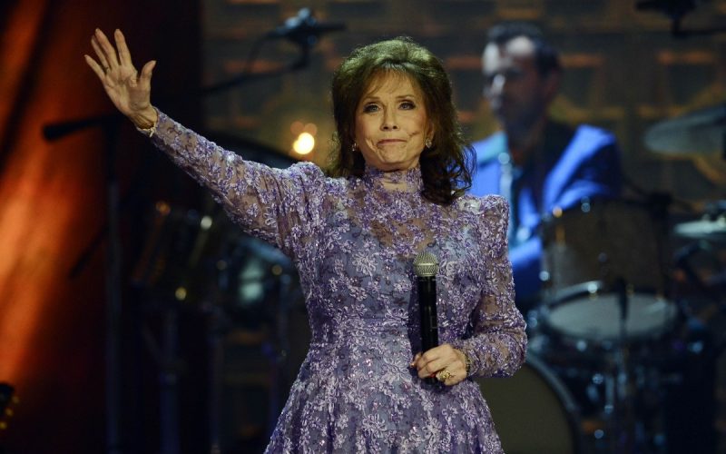 Loretta Lynn waves to the crowd after performing during the Americana Music Honors and Awards show Wednesday, Sept. 17, 2014, in Nashville, Tennessee. Lynn, the Kentucky coal miner’s daughter who became a pillar of country music, died on October 4, 2022, at her home in Hurricane Mills, Tennessee. She was 90. Photo: Mark Zaleski/AP Photo.