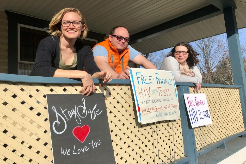 Brooke Parker (left), a care coordinator for the Ryan White HIV/AIDS program, is joined by Joe Solomon and Sarah Stone in Charleston, West Virginia. The program is a federal initiative that provides HIV-related services nationwide. Photo: John Raby/AP Photo