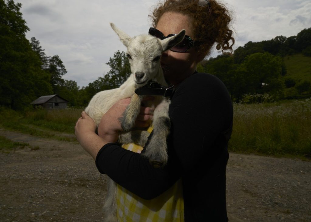 Bridget, 33, grew up around addiction. Today, she lives outside the western North Carolina town of Mars Hill with her boyfriend and a menagerie that includes her goats – Big Dote, Alice (because he looks like Alice Cooper) and Wenne (Wednesday Adams and Winifred Sanderson mashed together) – on a peaceful plot of land in a snug valley. Photo: Stacy Kranitz/For 100 Days in Appalachia