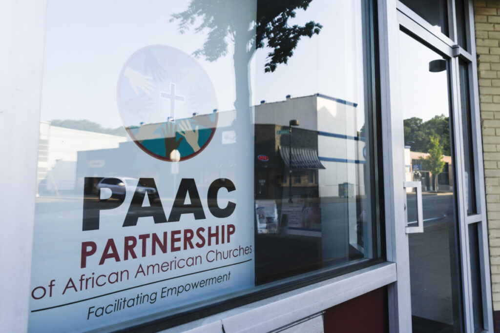 Sunshine illuminates the streets of Elk City, including signage for the Partnership of African American Churches, also known as PAAC, on Wednesday, May 17, 2023, in Charleston, West Virginia. Photo: Lexi Browning/100 Days in Appalachia