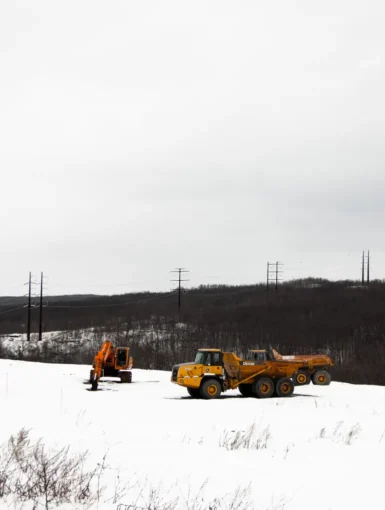 A high-voltage powerline runs behind a construction site in Archbald, Pennsylvania