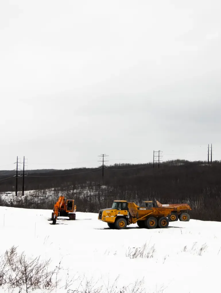 A high-voltage powerline runs behind a construction site in Archbald, Pennsylvania